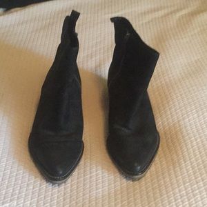 Cole Haan heeled boots.